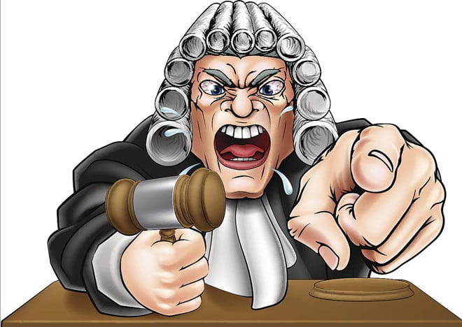 Cartoon shows an angry judge wearing a wig, holding a gavel in one hand and pointing straight ahead with the other.