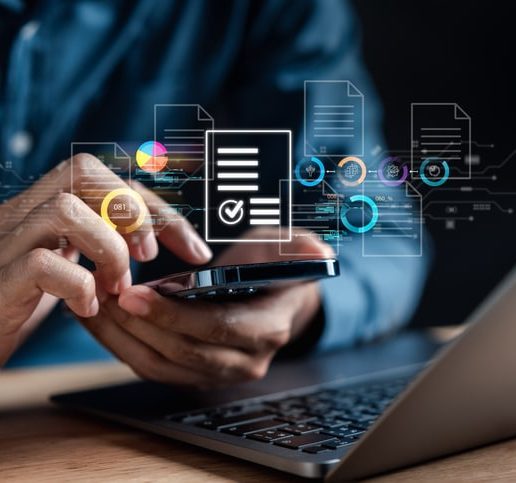 A person uses a smartphone and laptop whilst digital icons of charts and documents float above both devices, representing accessibility testing across multiple platforms.