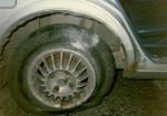 A close-up of the blown-out car tyre and the kerb that was hit by the car in June 1989 that Clive, Jess and their friends were in