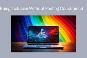 A laptop displaying a wheelchair symbol, with a rainbow background behind it, on a wooden table.