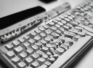 A computer keyboard looks like it has melted. The keys are wonky in places and most of the keys markings on them that do not make sense