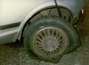 A close-up of the blown-out car tyre and the kerb that was hit by the car in June 1989 that Clive, Jess and their friends were in