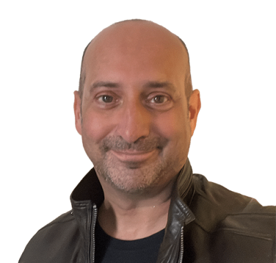 Clive Loseby, a passionate advocate for access for web and inclusive design, has brown eyes, no hair, has shaped stubble and is smiling