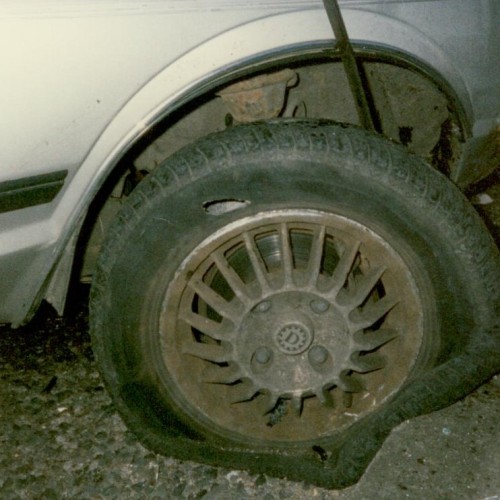 A close-up of the blown-out car tyre and the kerb that was hit by the car in June 1989 that Clive, Jess and their friends were in