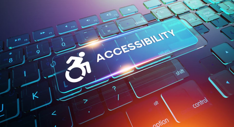 A computer keyboard with a glowing \ACCESSIBILITY\ key. The key features an accessibility icon of a person in a wheelchair. The background is a blend of blue, purple, and pink hues, creating a modern and vibrant look.