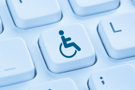 Web accessibility wheelchair symbol on a computer keyboard