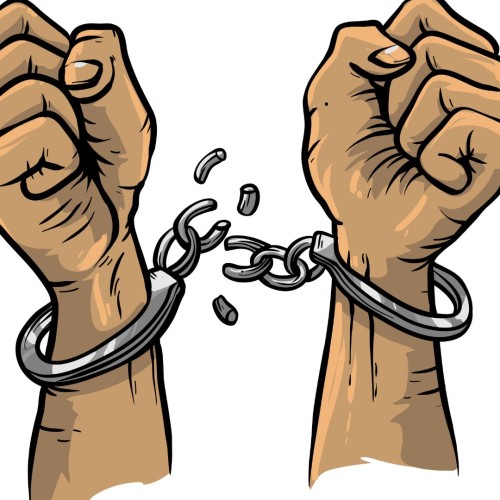 Two clenched fists, pointing upwards, in handcuffs that have been broken apart