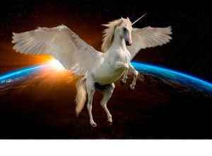 A beautiful unicorn with its wings outstretched is flying in space. The earth is in the background and the sunlight is creeping over the top.