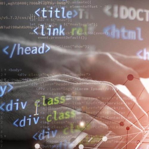 Fingers on keyboard writing html code