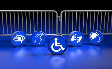 Blue icons representing different types of disabilities placed in front of metal barriers to illustrate the hidden obstacles people face online