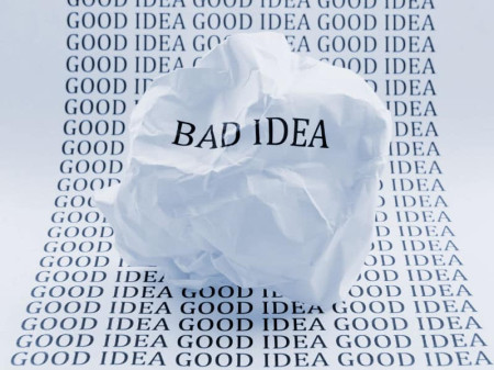 Bad Idea printed on screwed up paper, on top paper with the words Good Idea printed many times
